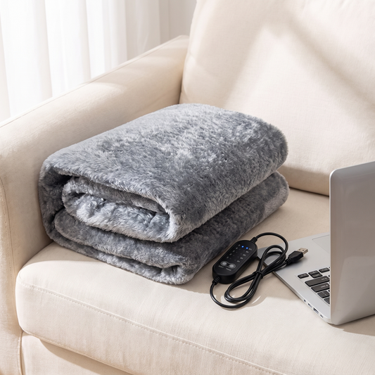 Grey USB electric blanket on an armchair